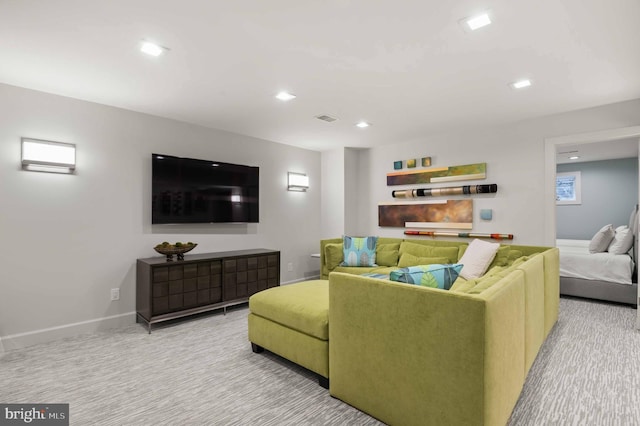 carpeted living area with visible vents, recessed lighting, and baseboards