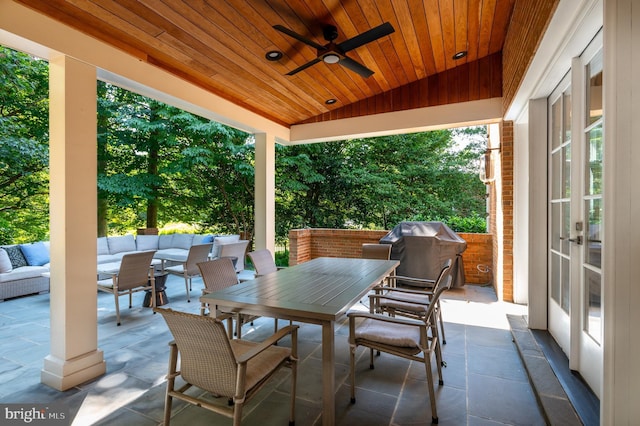 view of patio / terrace with outdoor dining space, a ceiling fan, an outdoor living space, french doors, and a grill