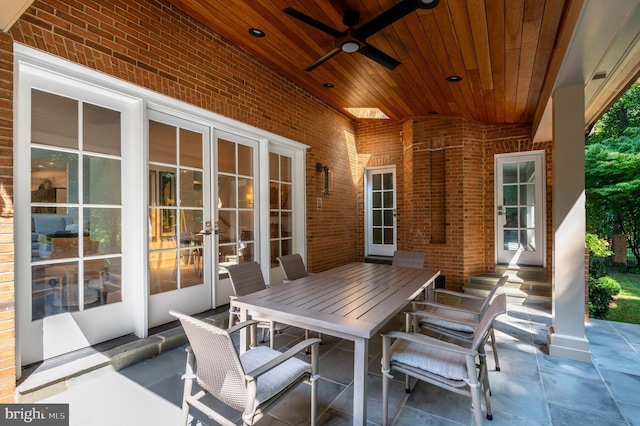 view of patio / terrace featuring french doors, outdoor dining area, and a ceiling fan