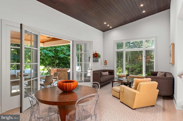 dining area featuring wood finished floors, recessed lighting, vaulted ceiling, wood ceiling, and french doors