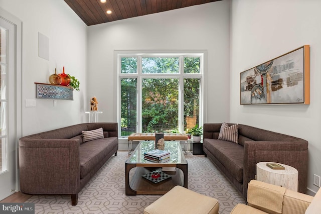 living area with recessed lighting, high vaulted ceiling, wood ceiling, and light wood finished floors