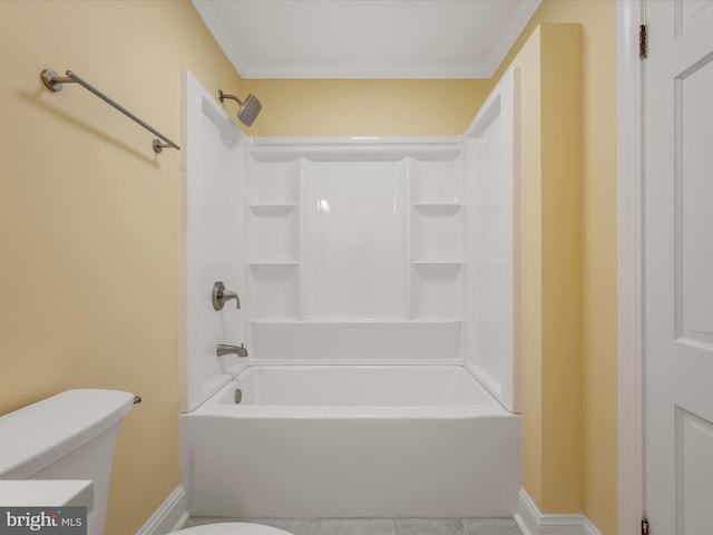 bathroom featuring shower / tub combination, toilet, and baseboards