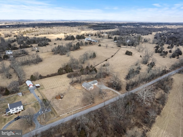 birds eye view of property featuring a rural view