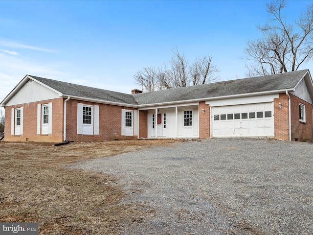 ranch-style house with an attached garage, brick siding, a shingled roof, driveway, and a chimney