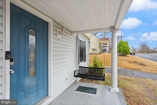 entrance to property featuring a porch