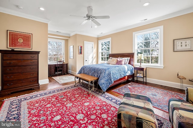 bedroom with recessed lighting, wood finished floors, visible vents, baseboards, and crown molding