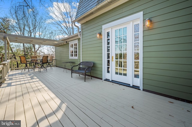 wooden deck featuring outdoor dining space