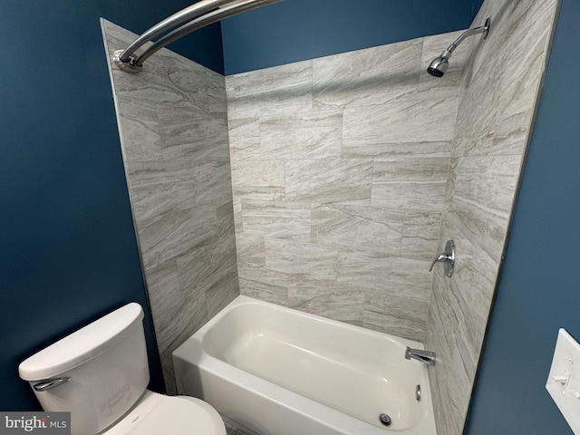 bathroom featuring toilet and bathing tub / shower combination