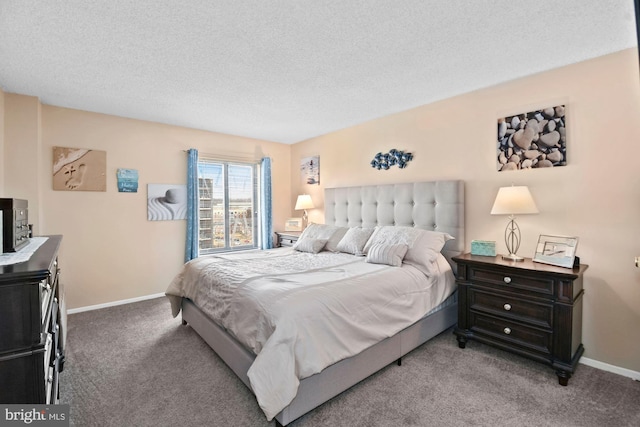 carpeted bedroom with baseboards and a textured ceiling