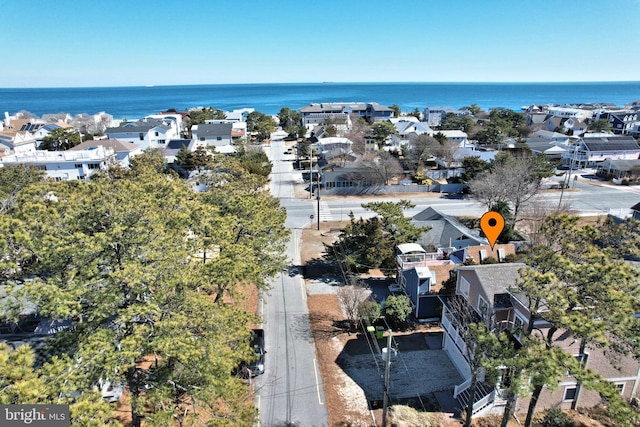 drone / aerial view featuring a water view and a residential view