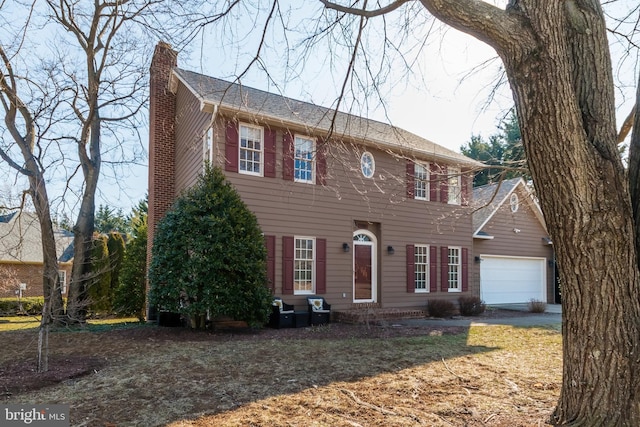 colonial inspired home featuring a chimney