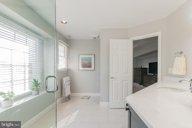 bathroom with recessed lighting, visible vents, vanity, baseboards, and tile patterned floors