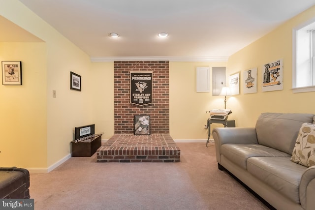 living area with carpet floors, baseboards, and ornamental molding