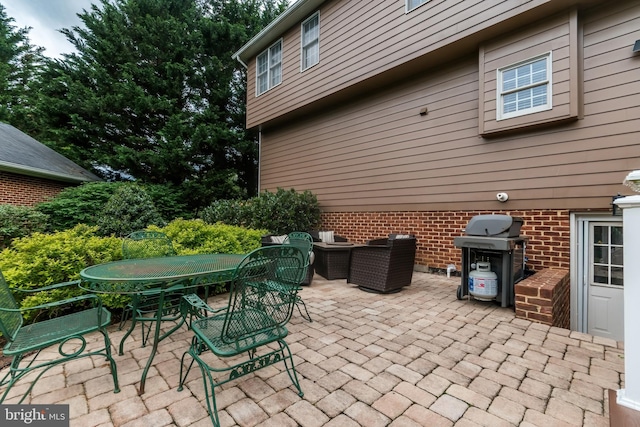 view of patio / terrace featuring outdoor dining space and grilling area