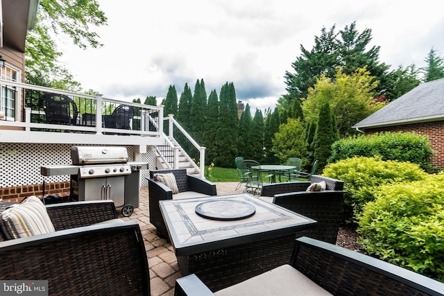 view of patio featuring area for grilling, outdoor lounge area, outdoor dining area, and stairway