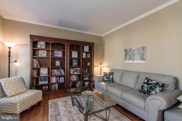 living room with ornamental molding and wood finished floors