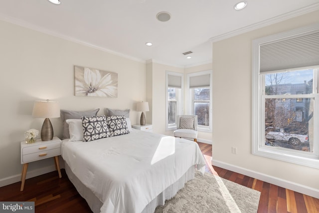 bedroom with dark wood-style flooring, recessed lighting, visible vents, ornamental molding, and baseboards