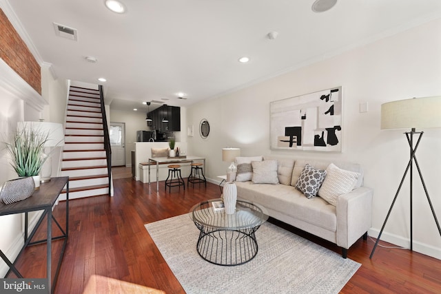 living room with visible vents, stairway, dark wood finished floors, and baseboards