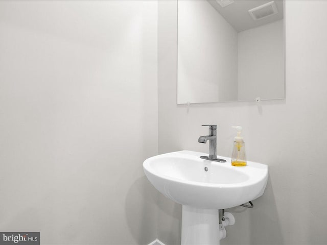 bathroom featuring a sink and visible vents