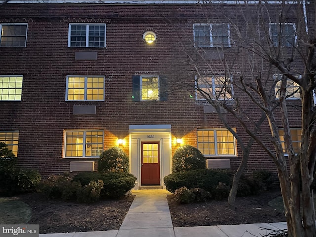 view of front of home featuring brick siding