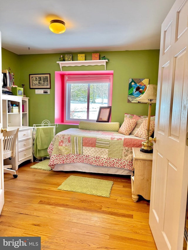 bedroom featuring light wood finished floors