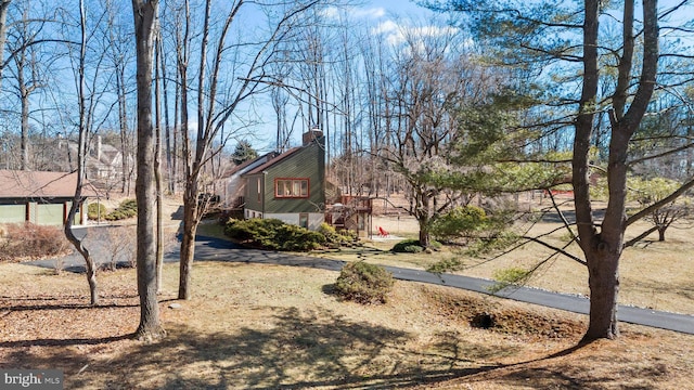 view of side of property featuring a chimney