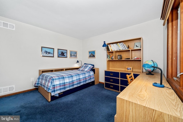 bedroom with dark colored carpet, visible vents, and baseboards