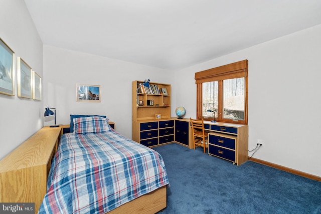 bedroom featuring dark colored carpet and baseboards