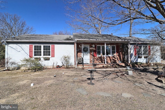 ranch-style house with covered porch