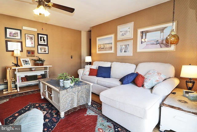 living room featuring wallpapered walls, ceiling fan, and dark wood-style floors