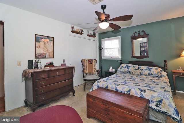 bedroom featuring light carpet, ceiling fan, and visible vents