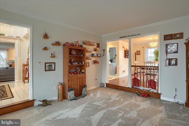 empty room with a healthy amount of sunlight, baseboards, and ornamental molding