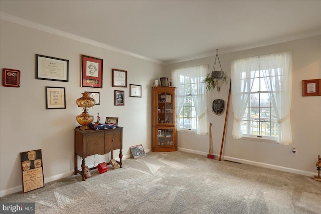 carpeted dining area with crown molding, baseboards, and visible vents