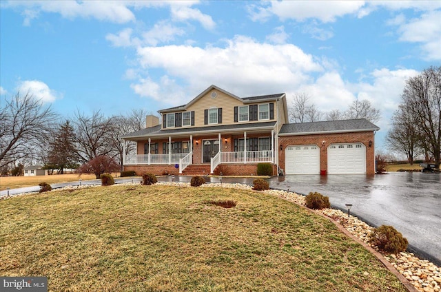 view of front facade with aphalt driveway, a porch, an attached garage, brick siding, and a front lawn