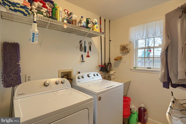 clothes washing area featuring laundry area and washer and dryer