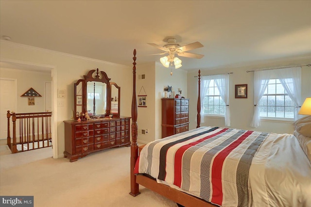 carpeted bedroom with ornamental molding