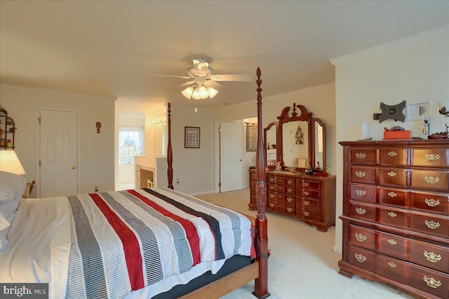 bedroom featuring ornamental molding, carpet, ceiling fan, and connected bathroom