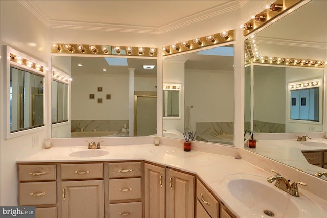 bathroom featuring a sink, ornamental molding, and a garden tub