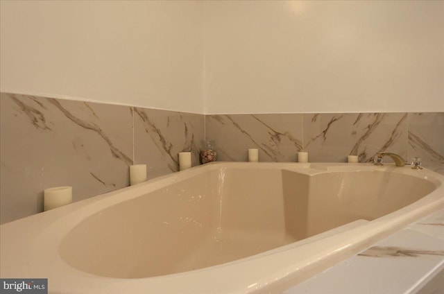 interior details featuring a tub