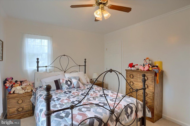 bedroom featuring crown molding, baseboards, ceiling fan, and light colored carpet