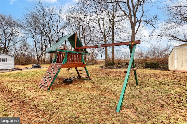 view of playground featuring an outbuilding and a storage shed