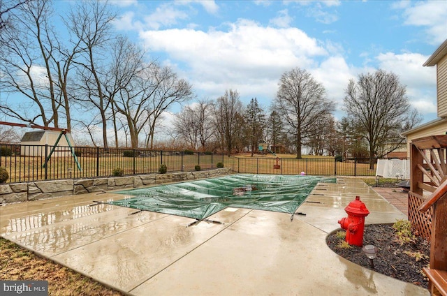 view of pool with a fenced in pool, a patio, and a fenced backyard