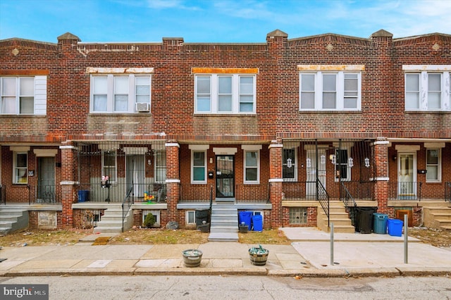 view of property featuring brick siding