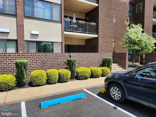 view of property featuring uncovered parking