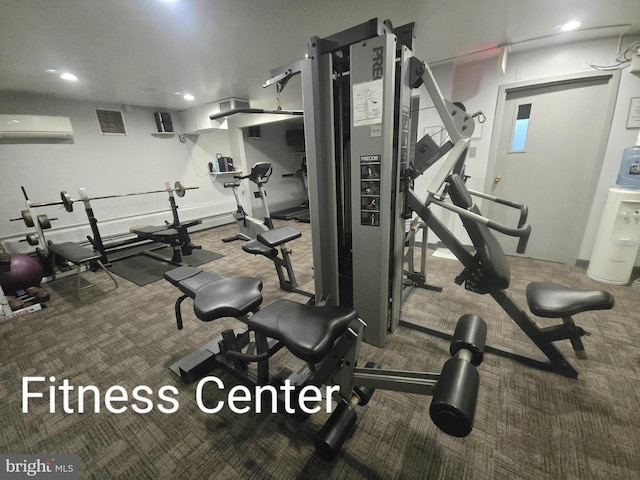 exercise room with carpet floors, a wall mounted AC, and recessed lighting