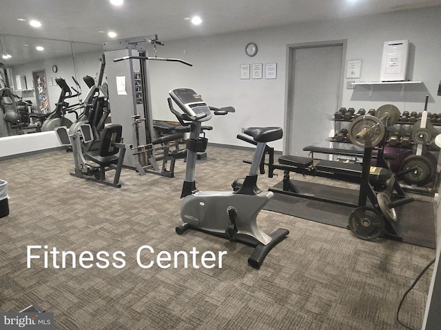 workout area featuring carpet flooring and recessed lighting