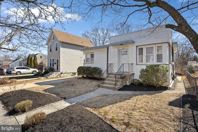 view of front of house featuring fence