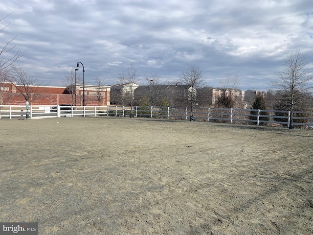 view of yard with an enclosed area and fence