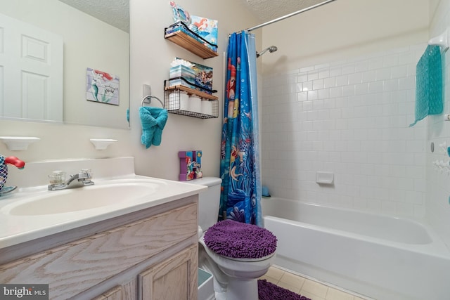 full bath with a textured ceiling, toilet, vanity, tile patterned floors, and shower / bath combo with shower curtain