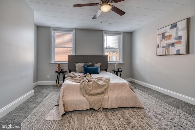 carpeted bedroom featuring ceiling fan and baseboards